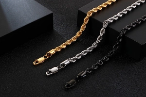 Macro shot of 6mm rope chains in gold, silver, and black with lobster clasps