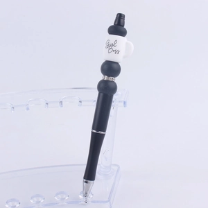 Macro detail of DIY beadable pen featuring a Girl Boss coffee cup and rhinestone ring