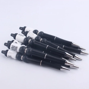 Creative DIY black beadable pens with humorous white coffee cup toppers and silver accents