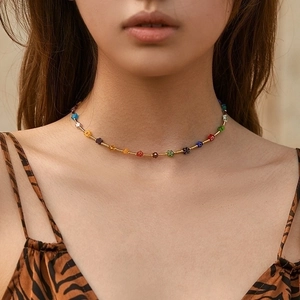 Handmade bohemian choker with colorful beaded flowers and golden metal spacers