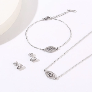 Detailed set of silver evil eye necklace, bracelet, and earrings with cubic zirconia