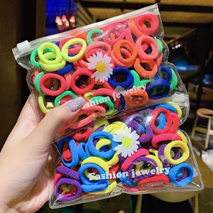 Multi-colored high elastic hair ties for girls in a daisy printed clear PVC zipper bag