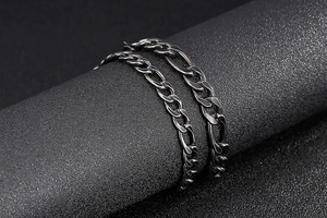 Close-up of vintage grey stainless steel curb chain bracelets with textured links