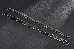 Detail of vintage steel Figaro chain bracelets with lobster clasps in two widths