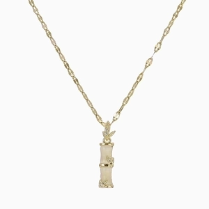 Minimalist gold bamboo pendant necklace with cream white inlay on a polished fine metal chain