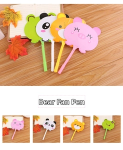 Detail of cute animal fan pens showing panda, pig, bear and frog designs on desk