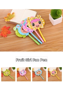Detail of four cartoon fruit girl fan pens in assorted pastel colors on a wooden desk