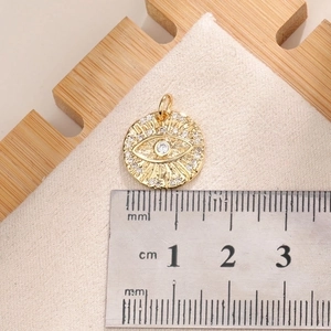 Detailed scale measurement of gold Evil Eye pendant with white cubic zirconia inlay
