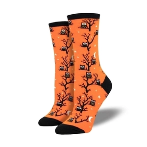 Detail of Halloween mid-calf socks with orange pumpkin, owl and dead tree patterns
