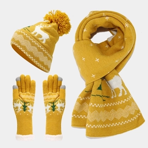 Detailed view of yellow Christmas knit set with reindeer and tree jacquard pattern