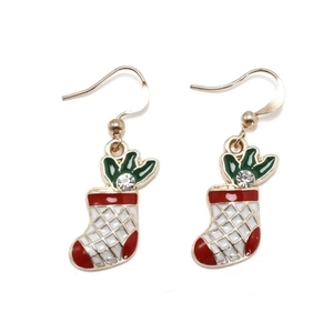 Detail of Christmas stocking drop earrings with festive red enamel and green leaf zircon