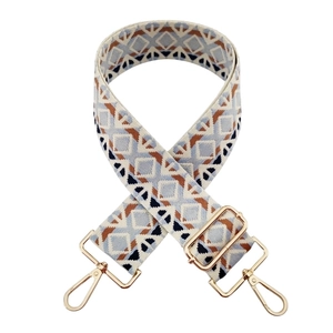 Bohemian geometric woven bag strap with golden metal clips in blue and brown