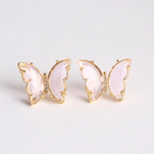 Detail of pink crystal butterfly stud earrings with gold plating and cubic zirconia