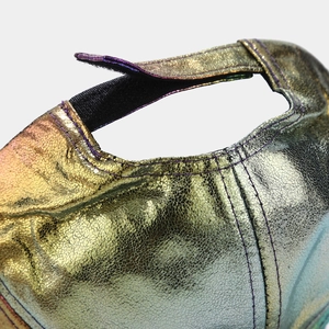 Macro detail of adjustable velcro strap on iridescent metallic baseball cap surface