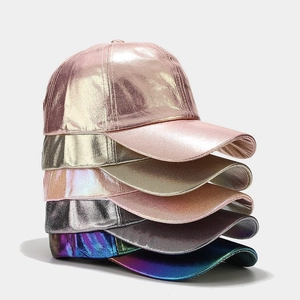 Stack of metallic PU baseball caps featuring holographic laser finishes and crinkle texture