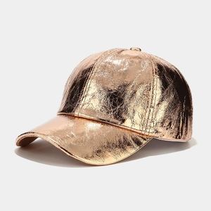 Detailed close-up of the rose gold metallic crinkled texture on this trendy baseball cap