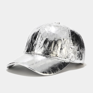 Close-up of metallic silver PU baseball cap featuring pleated texture and glossy finish