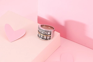 Macro detail of wide 304 stainless steel ring with rectangular stones and rose gold line