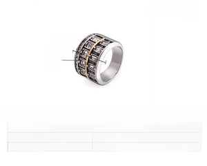 Detail of 18mm wide stainless steel ring with square cubic zirconia and gold accents