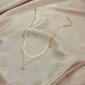 Double-layered gold titanium necklace with hollow butterfly charms and sleek snake chain