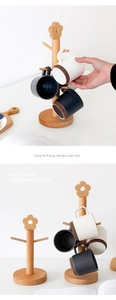 Detail of wooden beech cup holder with 6 hooks and flower top for mug storage