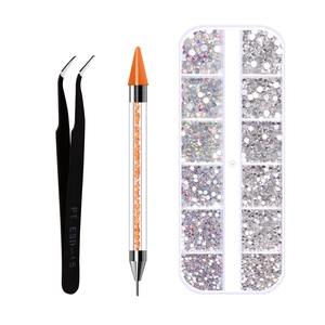 Close-up of nail rhinestone kit with ESD-15 tweezers, dotting pen, and 12-slot storage box