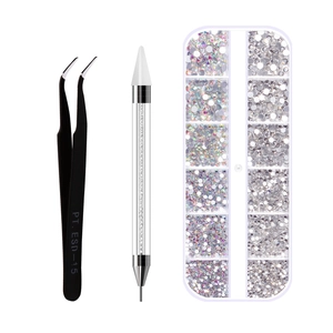 Detail of dual-ended wax pen, ESD-15 tweezers, and 12-grid rhinestone set with AB crystals