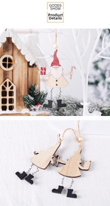 Detail of wooden Christmas Santa gnome with spring legs, candy cane and gift box