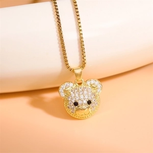 Sparkling gold teddy bear pendant necklace with zircon inlay and black gem eyes