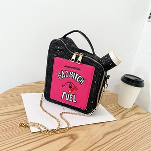 Detailed view of creative oil drum bag with sequin fabric and Bad Bitch Fuel embroidery