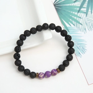 Black volcanic lava stone bead bracelet with purple imperial stones and bronze spacers