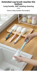 Detailed view of the long handle sponge cup brush for deep cleaning water bottles and glasses