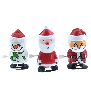 Detailed view of plastic wind-up toys featuring snowman and Santa Claus characters