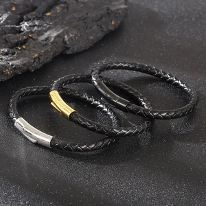 Three black braided leather bracelets with silver, gold, and black stainless steel clasps