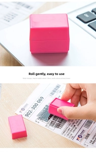 Detail of pink identity theft protection roller stamp covering sensitive data on mail