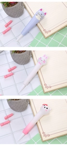 Close-up of cute cartoon stress relief pens with Totoro and kitty silicone toppers