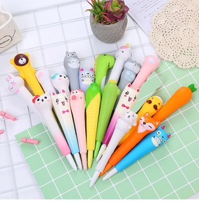 Close-up of cute cartoon stress relief pens including carrot, corn and cat designs