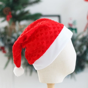 Plush red Christmas hat with embossed heart patterns for holiday party costume decoration