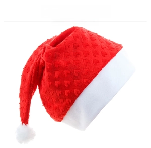 Detailed close-up of Christmas hat featuring heart-shaped embossed plush red fabric texture