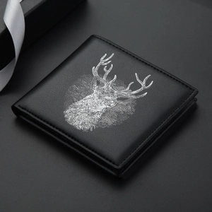 Slim black leather men's wallet featuring a detailed white reindeer illustration on the front