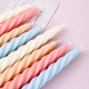 Spiral twisted soy wax scented candles in pastel pink, blue, cream, and orange colors