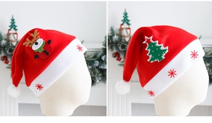 Detail of Christmas hats with cartoon reindeer and tree applique on soft felt fabric