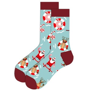 Detail of light blue Christmas socks with skateboarding Santa and reindeer patterns