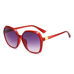 Modern square red translucent sunglasses with gradient lenses and gold accents