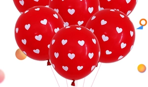 Detail of red latex balloons with white heart prints for romantic wedding decoration