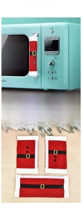 Detail of Christmas Santa themed microwave handle covers with red fabric and black belt decor