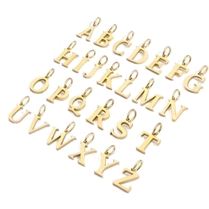 Top view of shiny gold-tone A-Z alphabet pendants for DIY jewelry making and necklaces