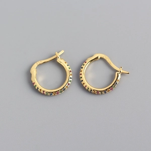 Macro shot of S925 sterling silver hoop earrings with multicolored pave-set gemstones