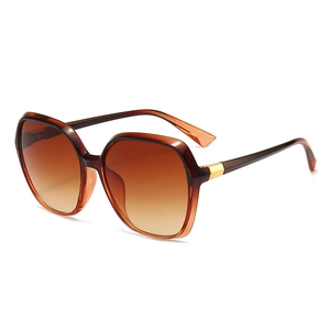 Chic women's oversized square sunglasses with gradient brown frames and gold metal accents