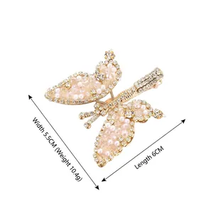 Sparkling butterfly hair clip with pearls and rhinestones on elegant gold metal base